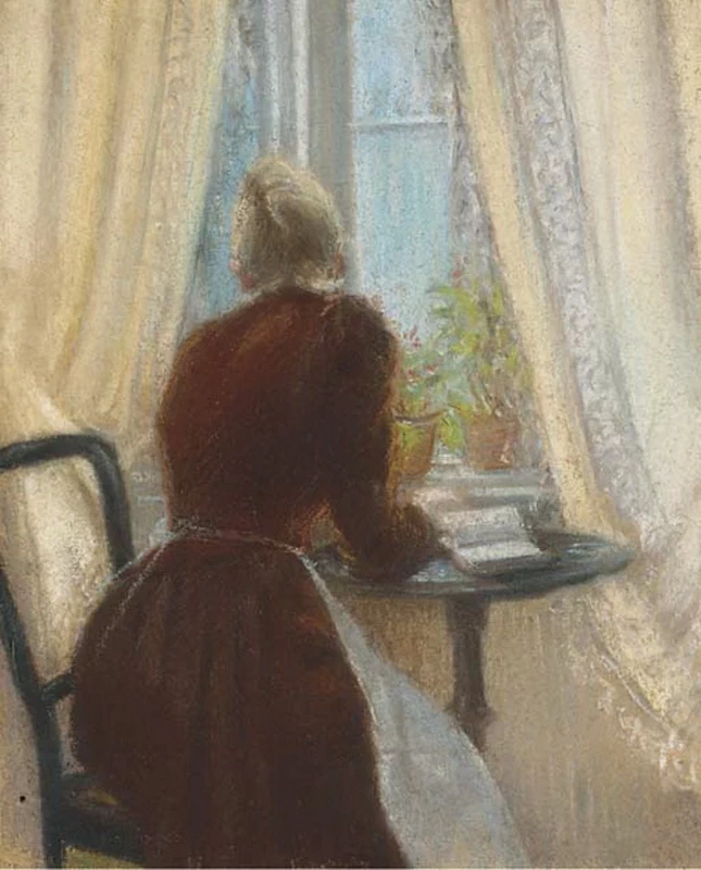 Donna seduta in un interno